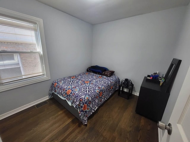 bedroom featuring dark hardwood / wood-style flooring