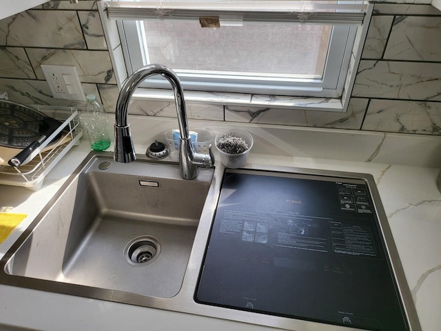 interior details with decorative backsplash and sink