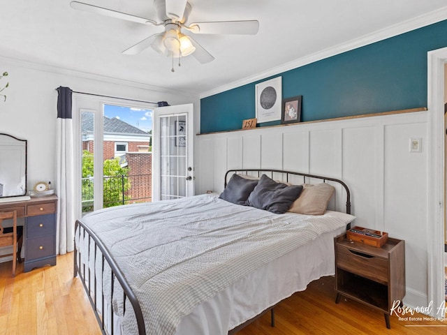 bedroom featuring ceiling fan, ornamental molding, and light wood-type flooring