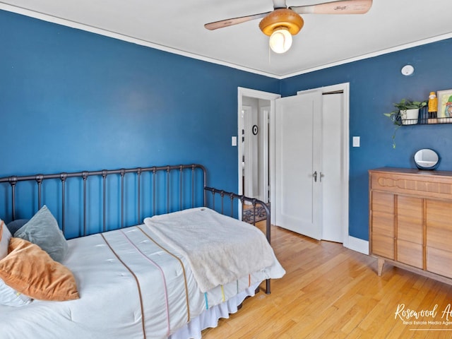 bedroom with ceiling fan and light hardwood / wood-style flooring