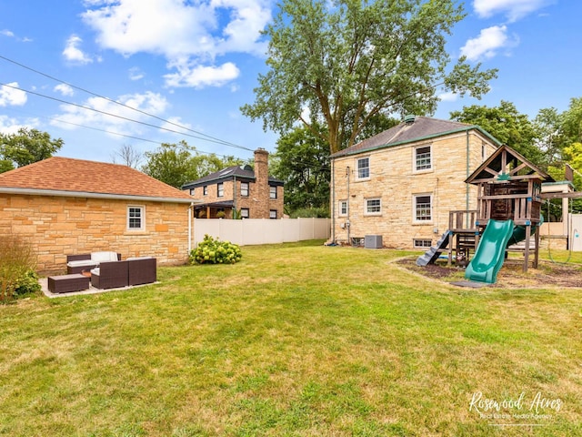 view of yard with outdoor lounge area, a playground, and central air condition unit