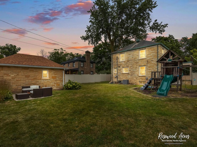 yard at dusk with a playground