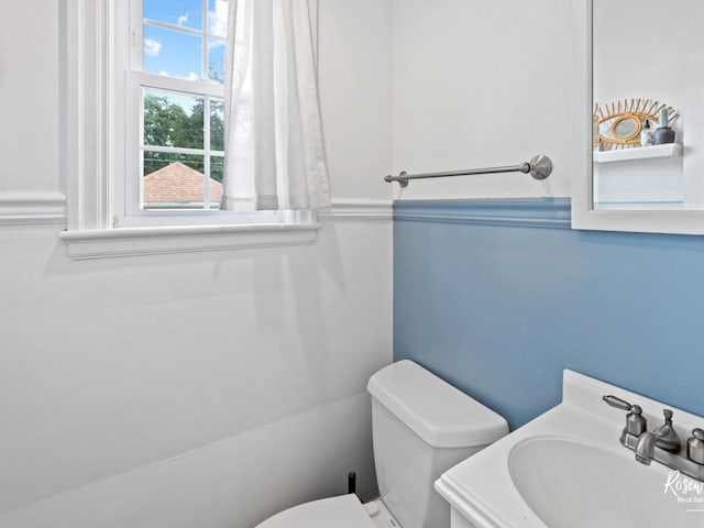 bathroom with sink and toilet