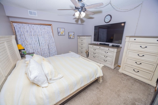 carpeted bedroom with ceiling fan