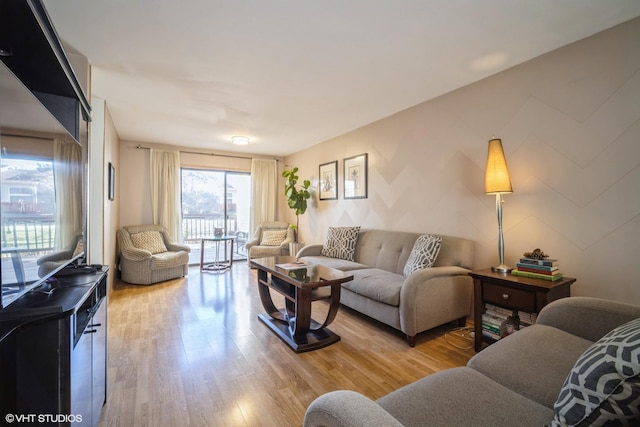 living room featuring light hardwood / wood-style flooring and plenty of natural light