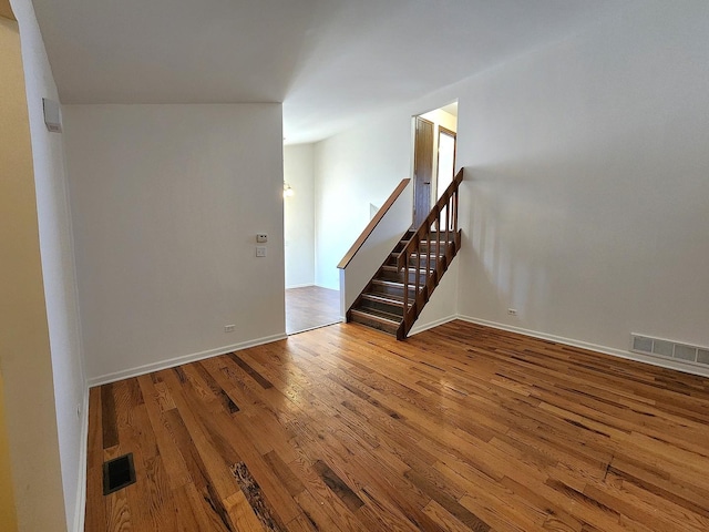 unfurnished room with wood-type flooring