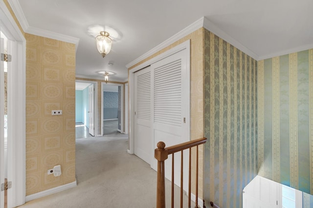 corridor with light colored carpet and ornamental molding