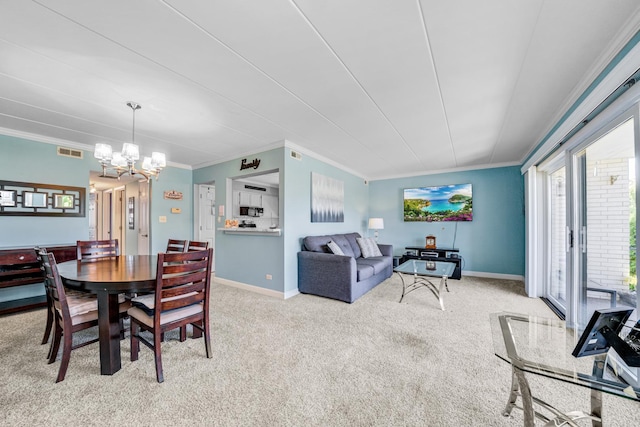 carpeted dining space featuring an inviting chandelier and crown molding