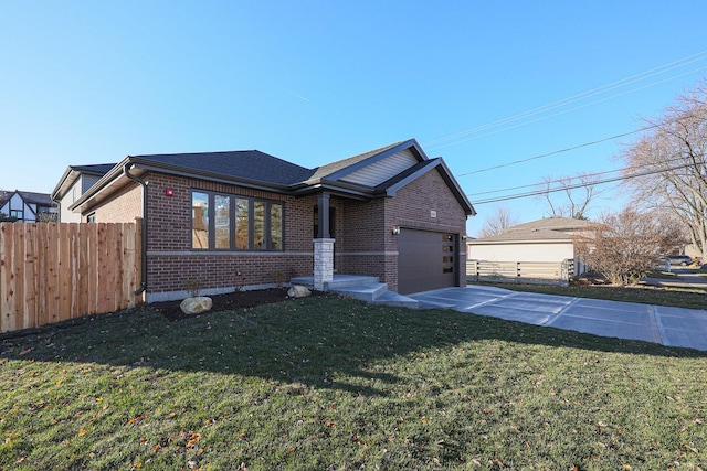 view of front facade with a front yard and a garage