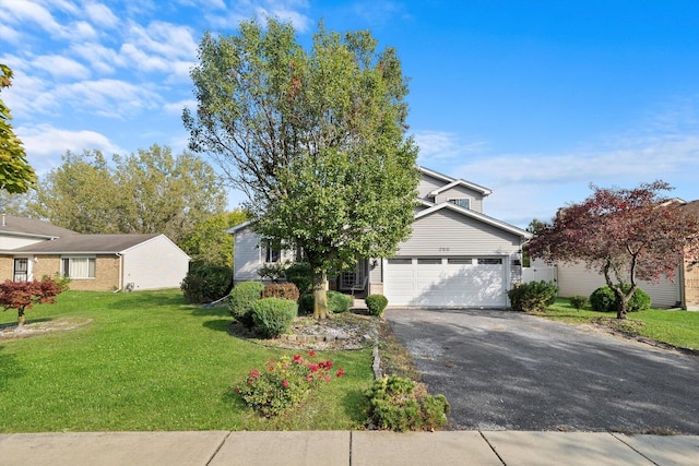 view of front of house with a garage and a front lawn