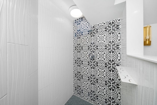 bathroom with tiled shower