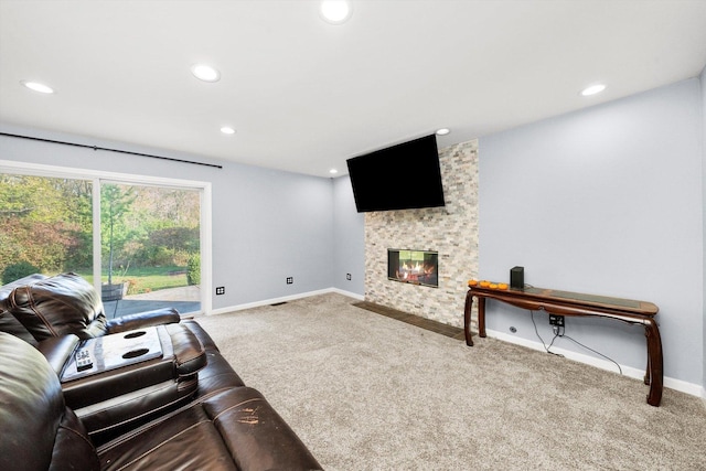 living room with a fireplace and carpet floors