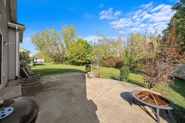 view of patio / terrace with a fire pit