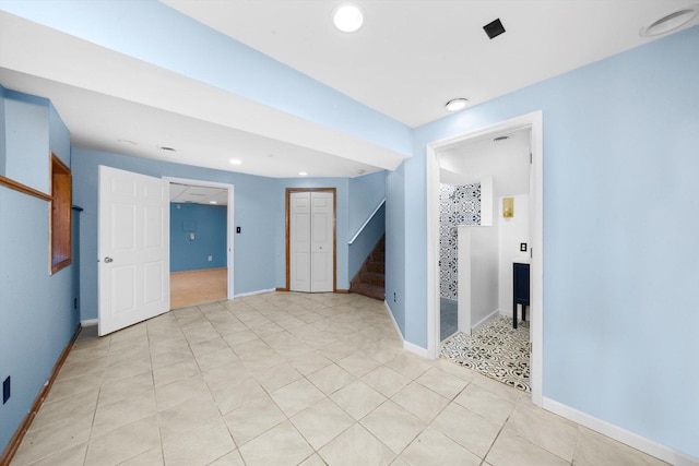 spare room with light tile patterned floors