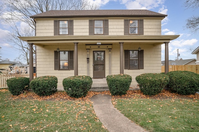 view of front facade featuring a porch and a front yard