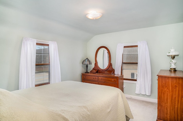 bedroom featuring carpet floors and vaulted ceiling