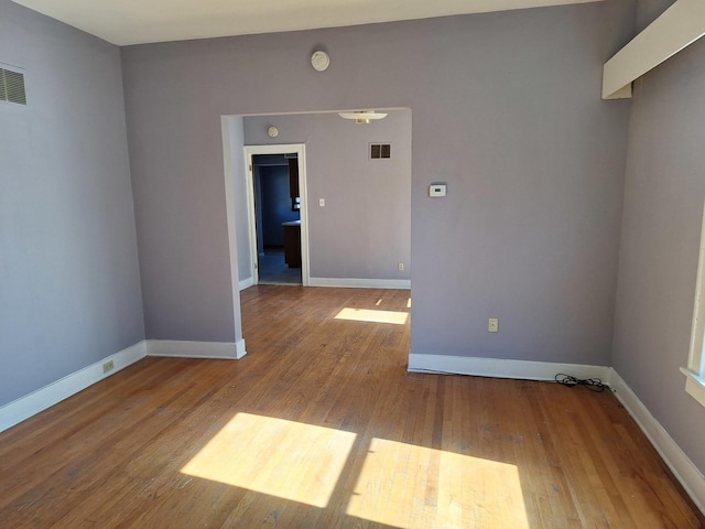 empty room with light hardwood / wood-style floors