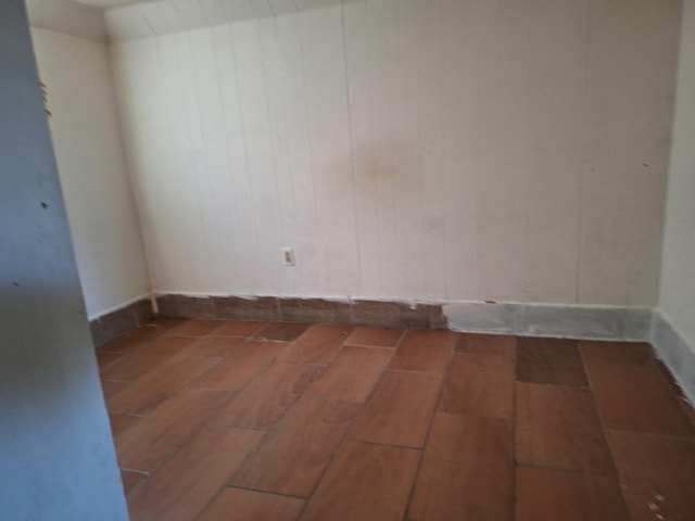 empty room with hardwood / wood-style floors