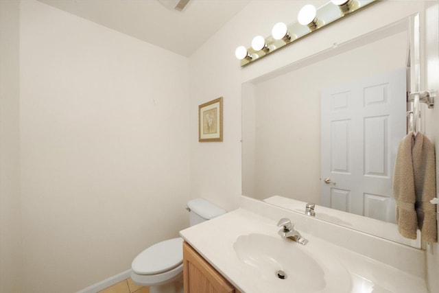 bathroom with tile patterned floors, vanity, and toilet