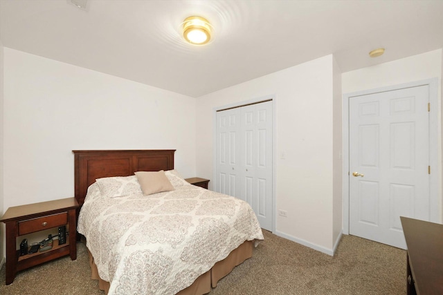 bedroom with a closet and light colored carpet