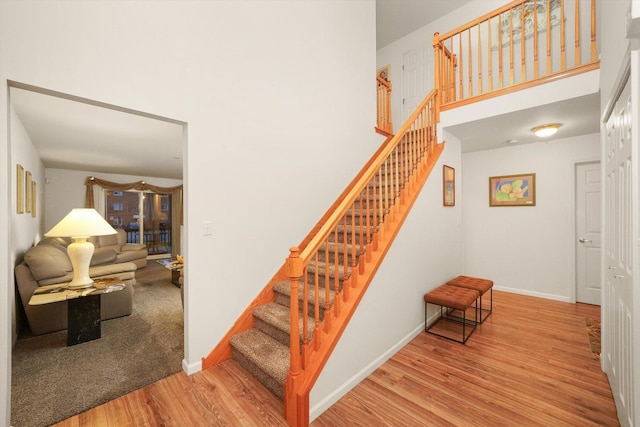 staircase featuring hardwood / wood-style floors