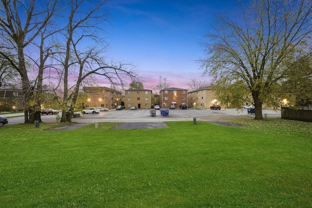 view of yard at dusk