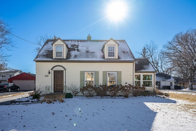 cape cod-style house with a garage