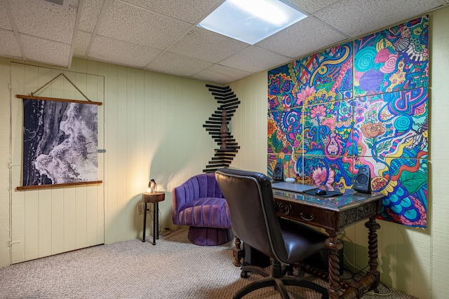 carpeted home office featuring a drop ceiling