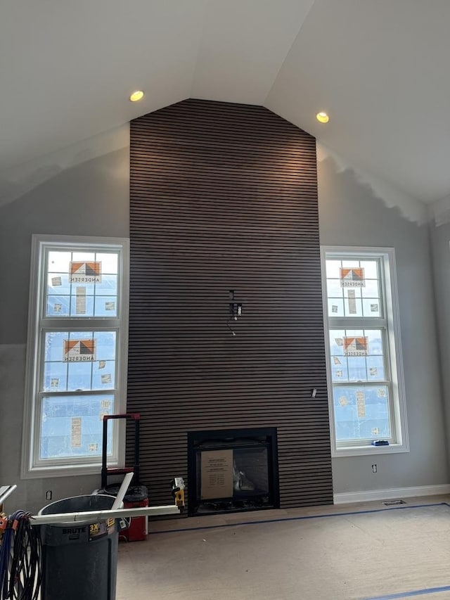 carpeted living room with vaulted ceiling