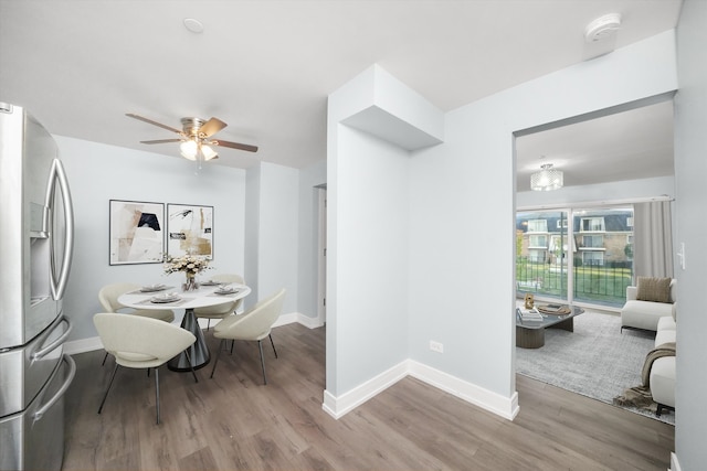 dining room featuring ceiling fan and wood-type flooring