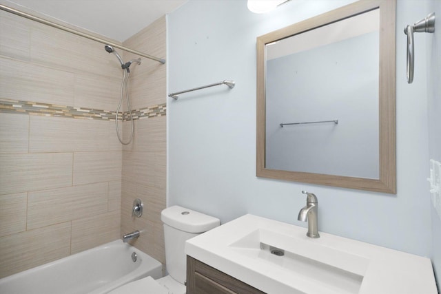 full bathroom featuring vanity, toilet, and tiled shower / bath combo