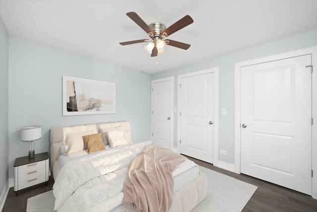 bedroom with ceiling fan and dark wood-type flooring