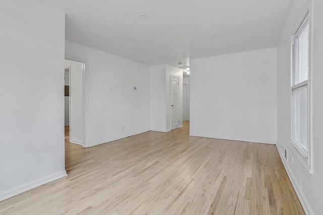 empty room with light hardwood / wood-style floors