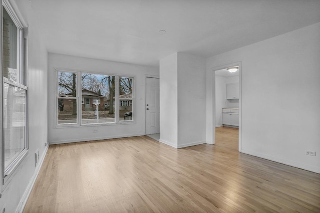 unfurnished room featuring light wood-type flooring