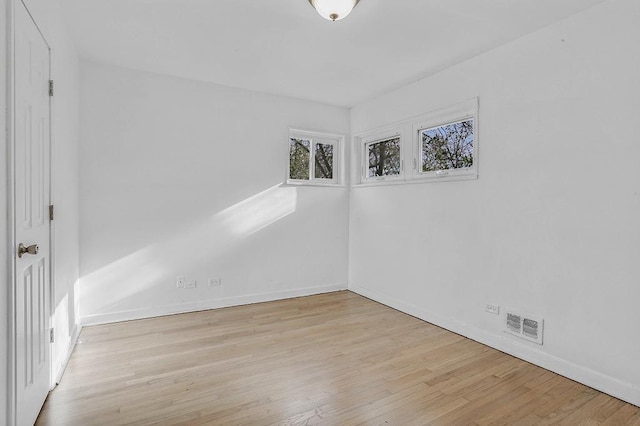 empty room with light wood-type flooring