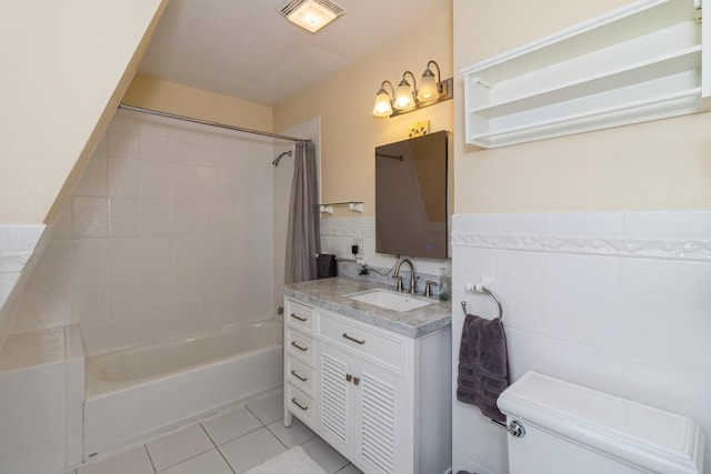 full bathroom featuring tile patterned floors, toilet, shower / tub combo with curtain, vanity, and tile walls