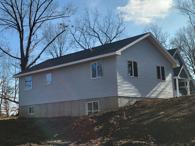 view of side of property featuring a sunroom