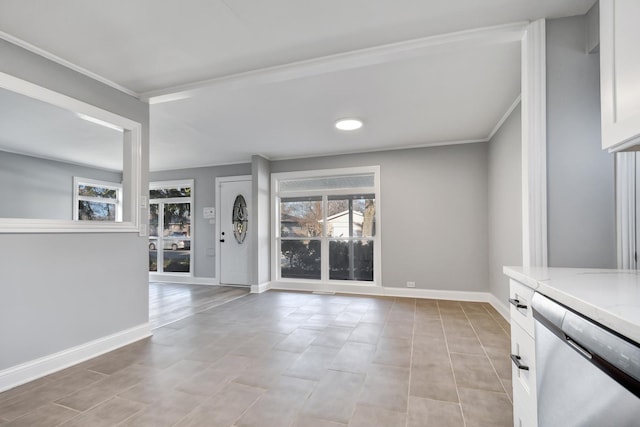 foyer entrance featuring ornamental molding