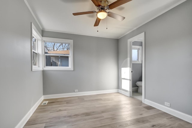 unfurnished bedroom with ceiling fan, light hardwood / wood-style flooring, ensuite bathroom, and ornamental molding