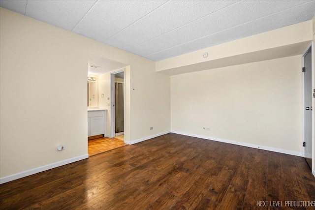 spare room featuring hardwood / wood-style floors