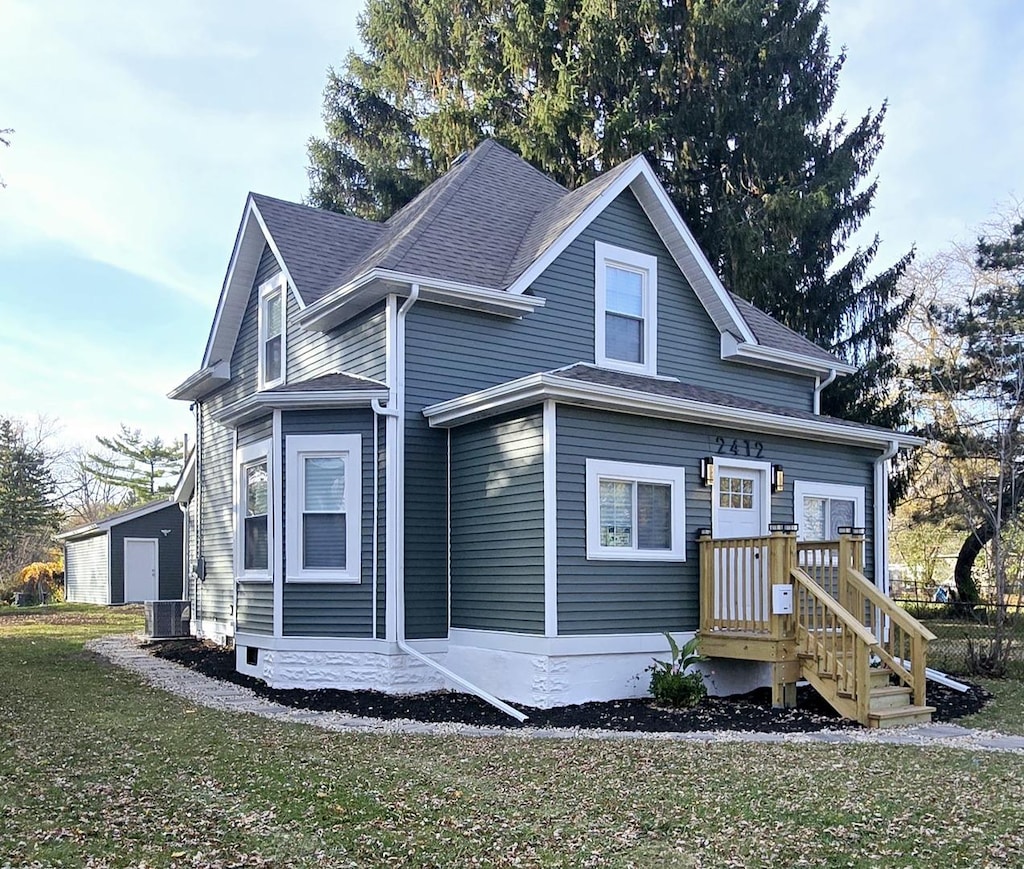 view of front of property with a front yard and a garage