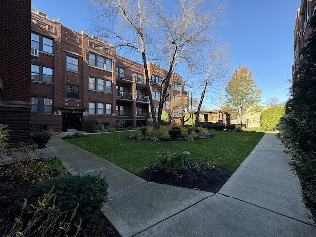 view of home's community featuring a yard