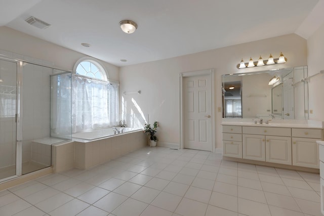 bathroom with tile patterned floors, vanity, and independent shower and bath