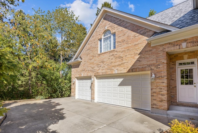 view of side of home with a garage