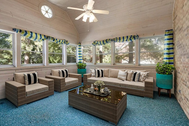 sunroom / solarium with a wealth of natural light, ceiling fan, wood ceiling, and vaulted ceiling