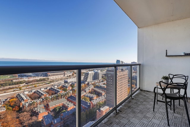 balcony featuring a water view