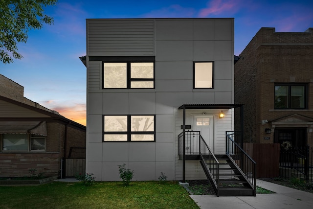 modern home featuring a yard