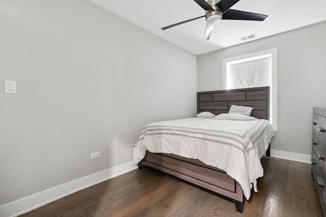 bedroom featuring ceiling fan and dark wood-type flooring