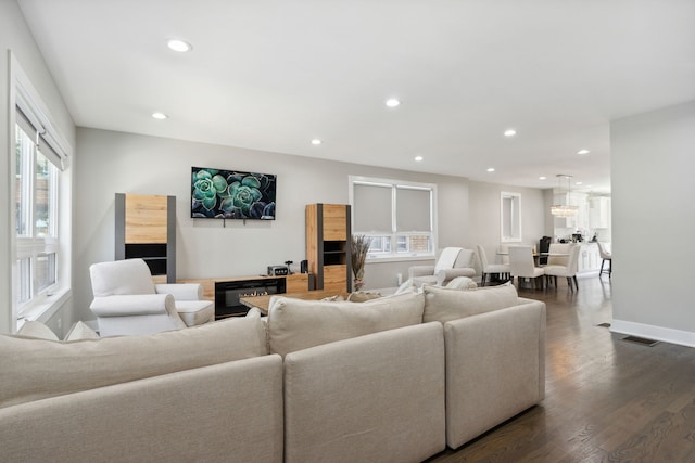 living room with dark wood-type flooring