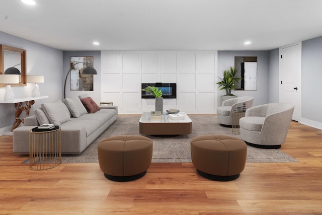 820 Exmoor Rd, Olympia Fields, IL 60461 - living area with recessed lighting, a tiled fireplace, light wood-style flooring, and baseboards